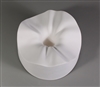 A circular white ceramic mold for fusing glass on a grey background. It is carved into a ruffled and waved shape around its outside, which drops quickly and deeply down into a small circle in the center.