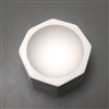 A tall octagonal white ceramic mold for fusing glass on a grey background. There is a thin flat border around the edge creating a circle that slopes gently inwards towards the center like an inverse dome.