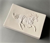 A rectangular white ceramic mold for fusing glass on a grey background. The corners curve upwards towards either end, creating a curved tray shape. The detailed side view of a horse galloping towards the right is textured onto the mold.