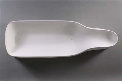 A bottle-shaped white ceramic mold for fusing glass on a grey background. The outer edges curve upwards, giving the mold a bowl-like shape.