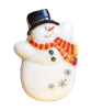 A snowman made of fused glass on a transparent background. His body is white and his top hat is black with a silver ribbon. His arms are raised, and he is wearing a red and yellow striped scarf. He has two black buttons, and silver snowflakes on his belly