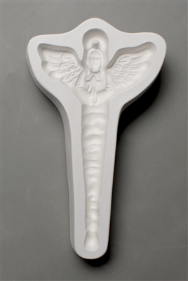 A T-shaped white ceramic mold for fusing hot glass on a grey background. A winged angel holding hands together in prayer with an elongated icicle body has been carved into it. There is a post in the angelâ€™s halo allowing for hanging after firing.