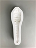 A long white ceramic mold for fusing hot glass on a grey background. A cat in a knit cap, scarf, and mittens and a body tapering into an icicle has been carved into it. The hat has a post in it allowing for hanging after firing.