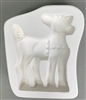 A roughly square-shaped white ceramic mold for fusing hot glass on a grey background. A profile of a standing deer in a jingle bell harness has been carved into it.