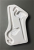 A long white ceramic mold for fusing hot glass on a grey background. Two simple flamingos with legs turning into stakes have been carved into it. They are facing opposite directions and the right stake is slightly smaller.