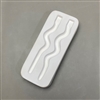 A rectangular white ceramic mold for fusing hot glass on a grey background. Two long, thin stakes have been carved into it. The stakes are plain in design and straight except for a couple gentle curves in the middle of each.