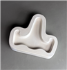 A T-shaped white ceramic mold for fusing hot glass on a grey background. A simple flat easel shape with a long back part and two slightly curved arms on either side has been carved into it.