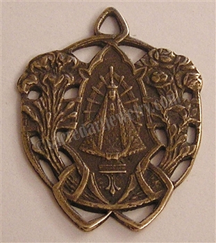 Our Lady of Lujan Etched Medal 1 1/4" - Catholic religious medals in authentic antique and vintage styles with amazing detail. Large collection of heirloom pieces made by hand in California, US. Available in true bronze and sterling silver.