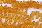 9x14mm Czech Beads Pressed Glass Leaves - Transparent Orange Gold Luster