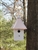 Our Hanging Cabin Bird House is lovely Hanging from a tree your garden. The copper roof adds to the beauty. Will patina over time