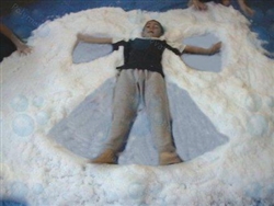 photo of kids playing with fake snow