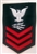 USCG Petty Officer First Class Rating Badge with Specialty:  TELECOMMUNICATIONS SPECIALIST (TC) - E6 - Red on Blue Serge