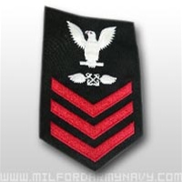 US Navy Petty Officer First Class Rating Badge - E6: AB - Aviation Boatswains Mate - Male - Red on Blue Serge