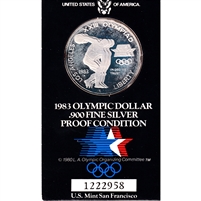 1983 S USA Olympic Dollar .900 Silver Proof in Card (Lightly toned)