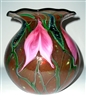 Daniel Lotton Vase
Beautiful Round shape with fluted lip.
Gold Ruby Sunset with Pink Drop Leaf Flower
Really Pretty
Size 9  by  8
Signed Daniel Lotton Dated 2016