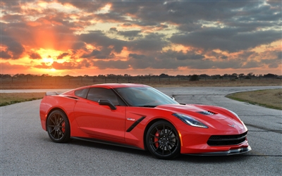 Red Corvette w/ Setting sun in background