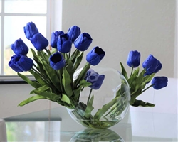 Crosswinds vase 12" x 11" with two bundles of blue tulips anchored in our illusion water - * Special Order