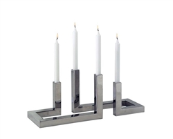 Stylish candle holder set in stainless steel and polished steel finish. A great accent for your home.