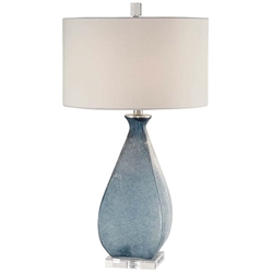 Atlantica Modern Lamp. Deep ocean blue glass with an acid etched texture, accented with brushed nickel plated details and a thick crystal foot. The round hardback drum shade is a white linen fabric.
