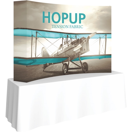 8ft Curved HopUp 3x2 Tabletop Fabric Display with Full Fitted Graphic is the instant trade show table top solution! Hopup is an all new light weight yet heavy duty frame that suspends a fabric graphic image