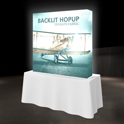 5ft x 5ft Backlit HopUp Trade Show Display  has a light weight, heavy duty frame that holds a fabric graphic mural. 5ft x 5ft foot backlit Hop Up display is a great upgrade to our standard Hop Up line trade show exhibits.