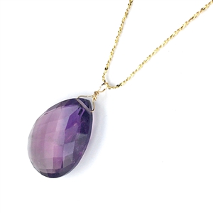 A faceted amethyst teardrop necklace on a gold vermeil sterling silver chain