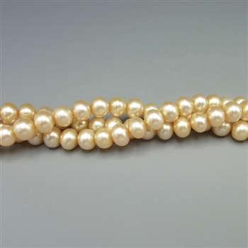 5-5.5mm round champagne fresh water pearls, one 16" strand