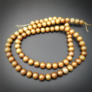 4.5-5mm honey colored round fresh water pearls, one 15 inch strand