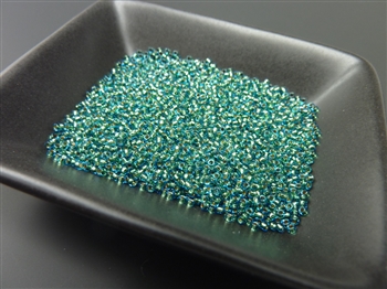 Toho size 15/0 round seed beads, color 756 (24k gold lined teal), 12g tube