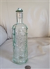 Vintage floral embossed aqua green bottle