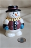 Colorful snowman wax candle