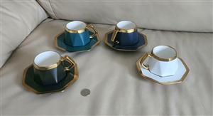 Set of six vintage porcelain multicolor teacups and saucers in black white navy blue and emerald green with gold geometrical pattern Set of six vintage porcelain multicolor teacups and saucers in black white navy blue and emerald green with gold geometrical pattern