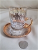 Safi Com glass gold and silver cup and saucer