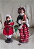 Two women carolers Christmas holiday display