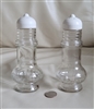 Tall clear glass salt or pepper shaker with topper