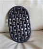 Cast iron trivet in woven design