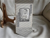 Vintage baby picture in a cardboard envelope frame