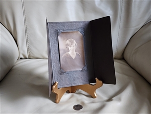 Women picture in vintage tri fold cardboard frame