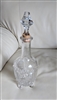 Etched glass decanter embossed sides footed design