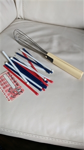 Vintage hand whisk and stirring sticks plastic