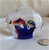 Vintage clear glass paperweight with reef and fish