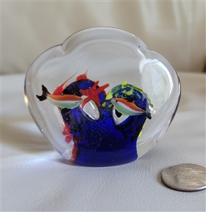 Vintage clear glass paperweight with reef and fish