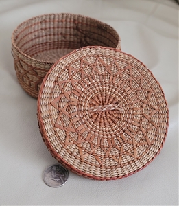 Round grass woven basket storage in pastel colors