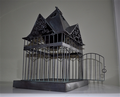Metal bird cage display in Victorian house style