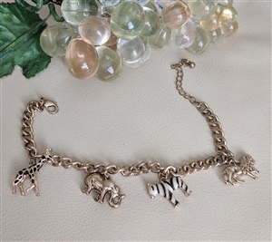 African animals charm bracelet in gold tone metal