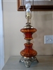 Amber glass post and gold tone metal table lamp