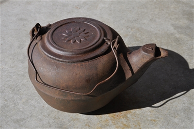 Vintage cast iron kettle with lid