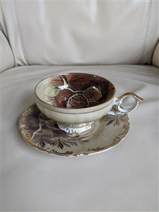 Porcelain teacup and saucer PineCones decor theme