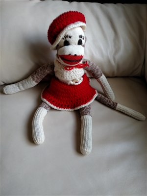Vintage stuffed Sock Monkey in crochet dress