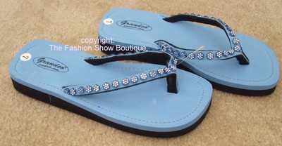 Blue flip flops with rhinestone flower trim